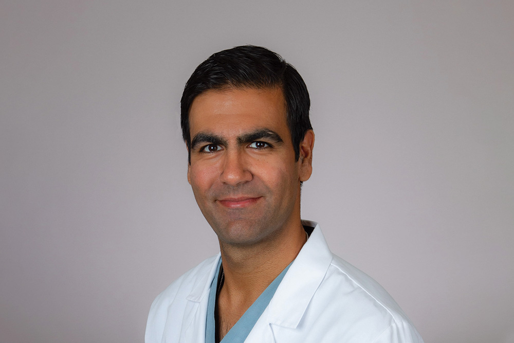 Studio portrait of Arash Motamed, MD, MBA