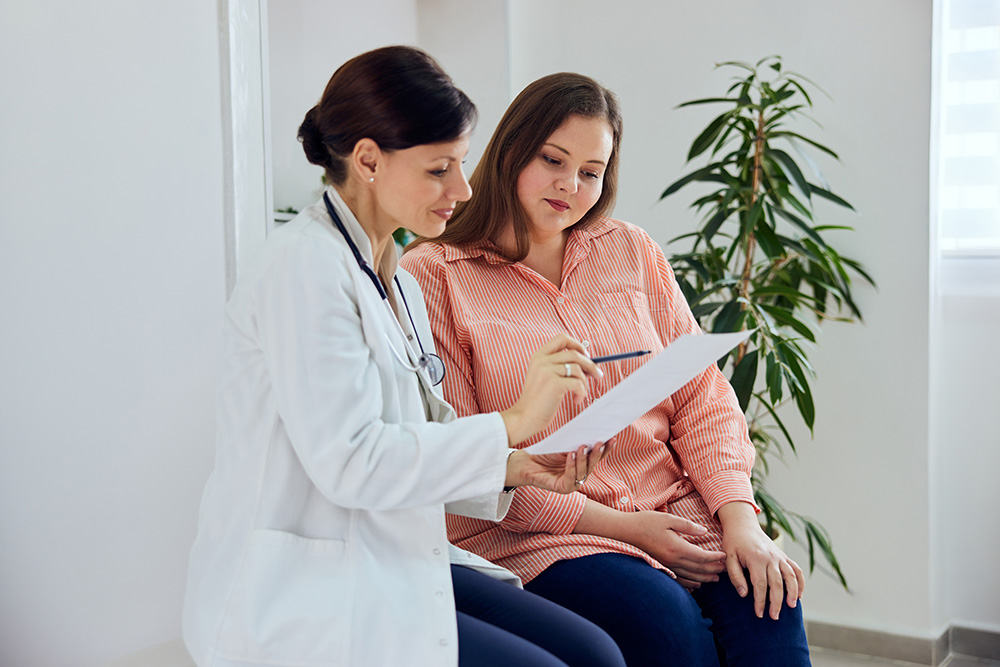 Doctor talks to patient about obesity treatment options.