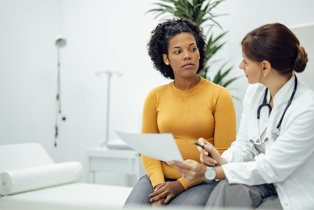 Cancer patient questions doctor about radiation treatment.